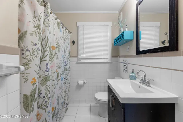 a view of a patio with table and chairs and potted plants