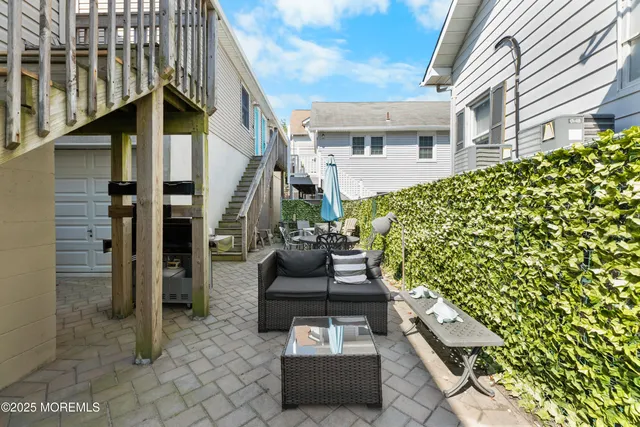 a kitchen with stainless steel appliances granite countertop a refrigerator stove top oven and sink