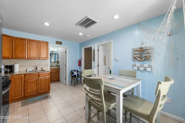 a bedroom with a bed and flat screen tv