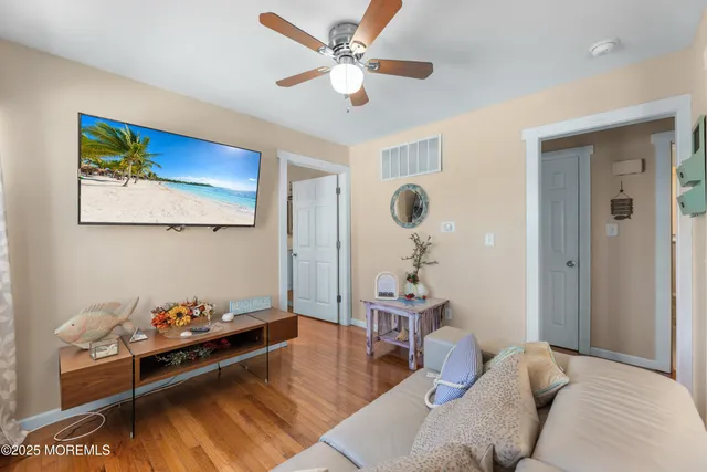a kitchen with stainless steel appliances a dining table chairs and granite counter tops