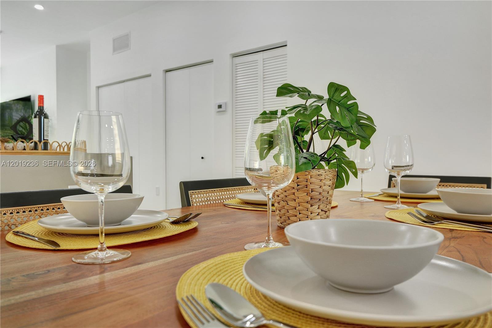 2001 Southwest 22nd Terrace Miami, FL 33145 - Photo 8 of 31 a living room with dining table and a potted plant