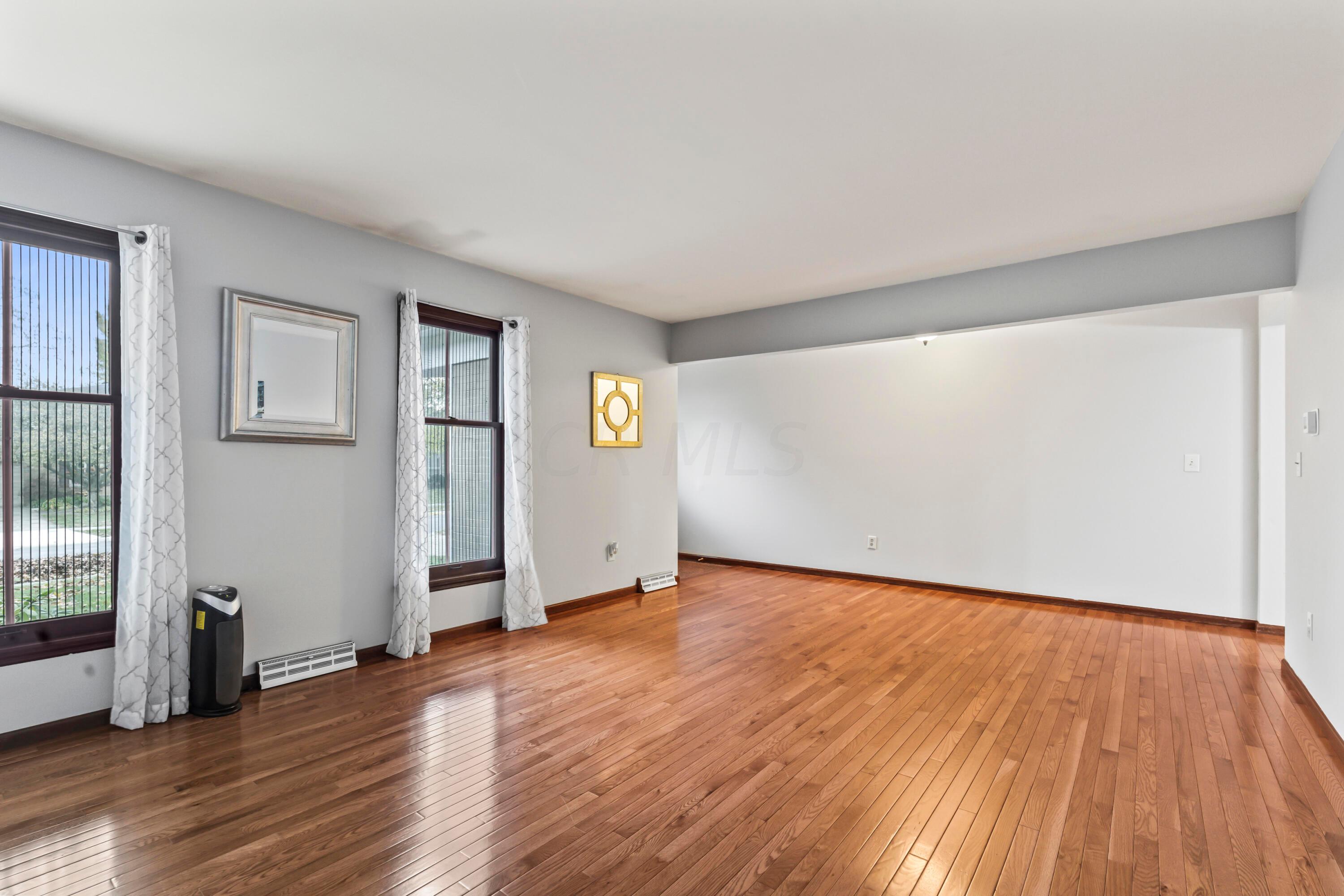 7020 Rieber Street Columbus, OH 43085 - Photo 5 of 40 • New hardwood flooring ~ 2012 • Grey painted walls • Drapes are negotiable