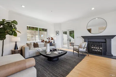 a living room with furniture and a rug