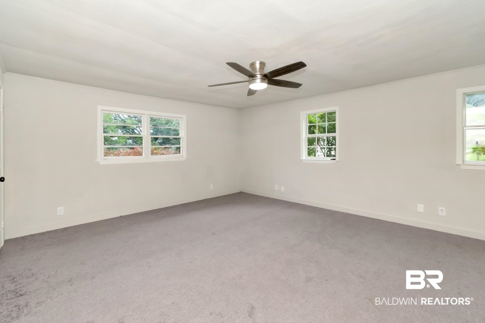 1334 Leroy Stevens Road Mobile, AL 36695 - Photo 36 of 46 Carpeted spare room with healthy amount of natural light and ceiling fan