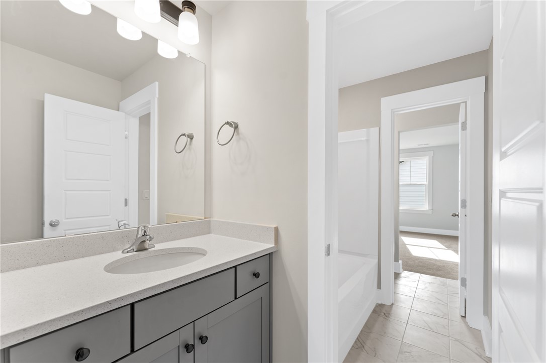 167 Tiger Lily Drive Anderson, SC 29621 - Photo 19 of 34 A well-lit bathroom vanity with ample counter space and a clean, neutral palette.