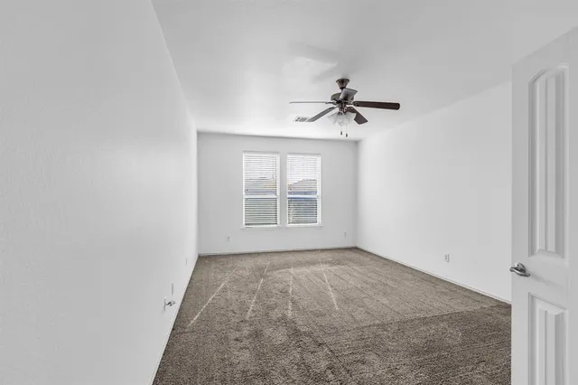 a view of a big room with carpet