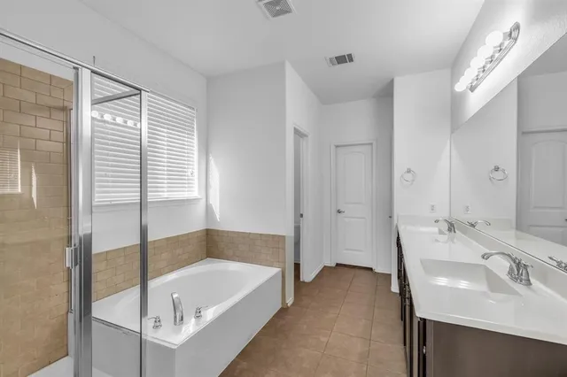 a bathroom with a bathtub and toilet