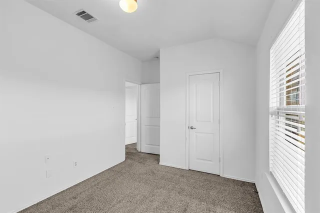 a view of a ceiling fan and hardwood floor