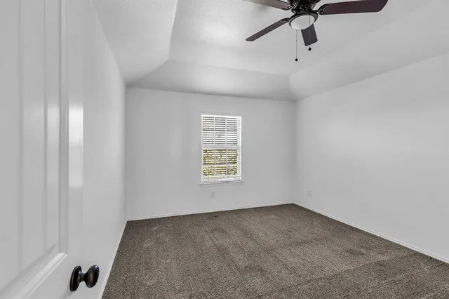 a view of staircase with wooden floor and mirror
