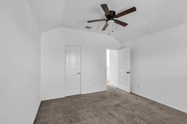 a balcony with furniture and a potted plant