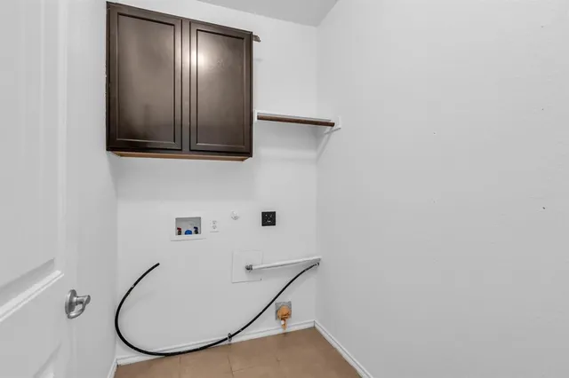 a front view of a house with a yard table and chairs