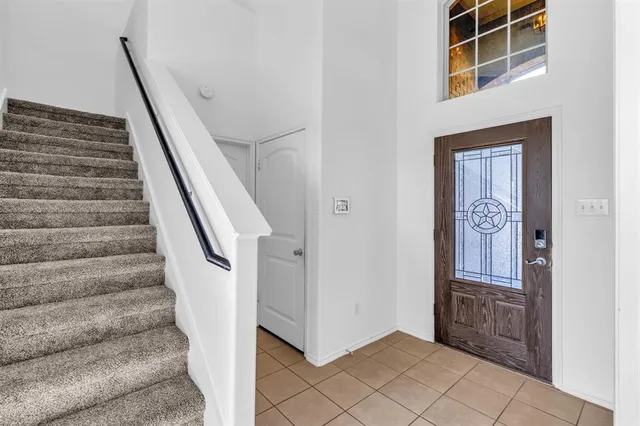 a view of a bedroom with wooden floor