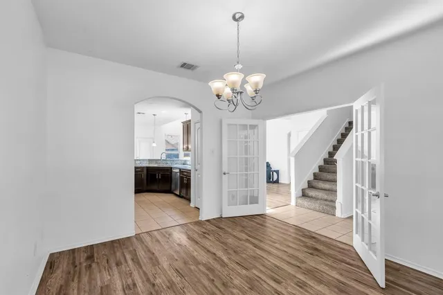a living room with fireplace furniture and a wooden floor