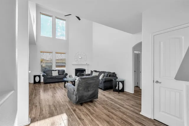 a living room with furniture and a fireplace