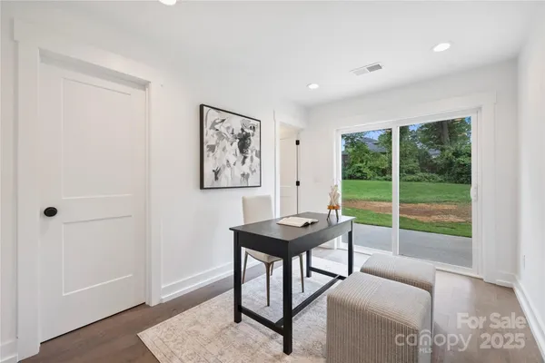 a view of a livingroom with furniture and window