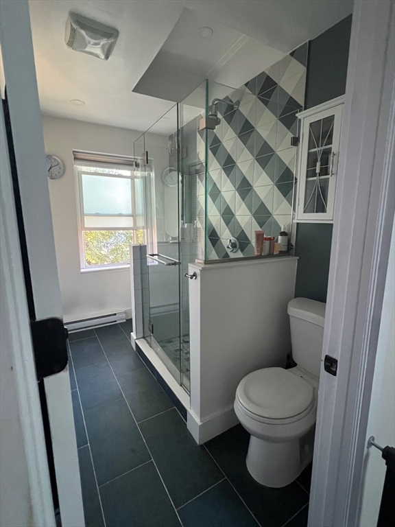 27 Swallow Street, Unit 3 Boston, MA 02127 - Photo 6 of 8 a bathroom with a toilet and a shower