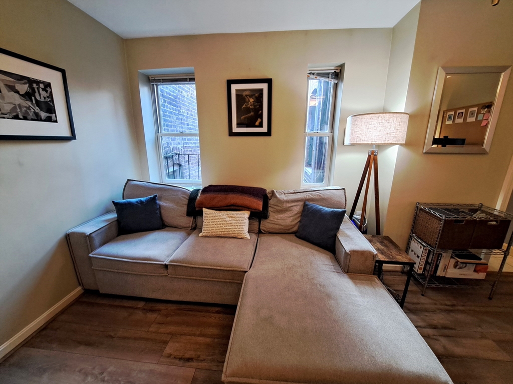 38 Charter Street, Unit 11 Boston, MA 02113 - Photo 13 of 17 a bedroom with furniture and a lamp