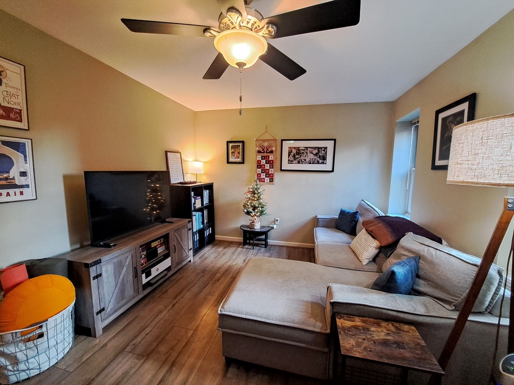 38 Charter Street, Unit 11 Boston, MA 02113 - Photo 15 of 17 a living room with furniture and a flat screen tv
