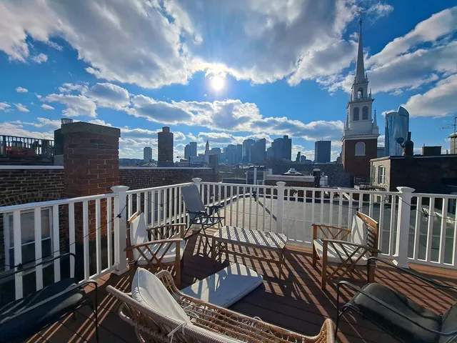 a view of balcony with wooden floor