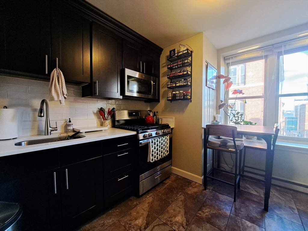 38 Charter Street, Unit 11 Boston, MA 02113 - Photo 3 of 17 a kitchen with a sink appliances and cabinets