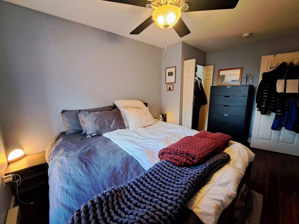 38 Charter Street, Unit 11 Boston, MA 02113 - Photo 7 of 17 a bedroom with a bed and a chandelier