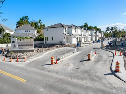 a view of a patio with a table and chairs under an umbrella