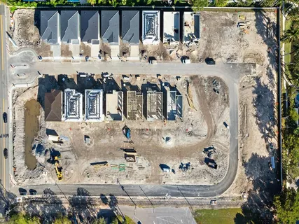 a view of a street with a building in the background