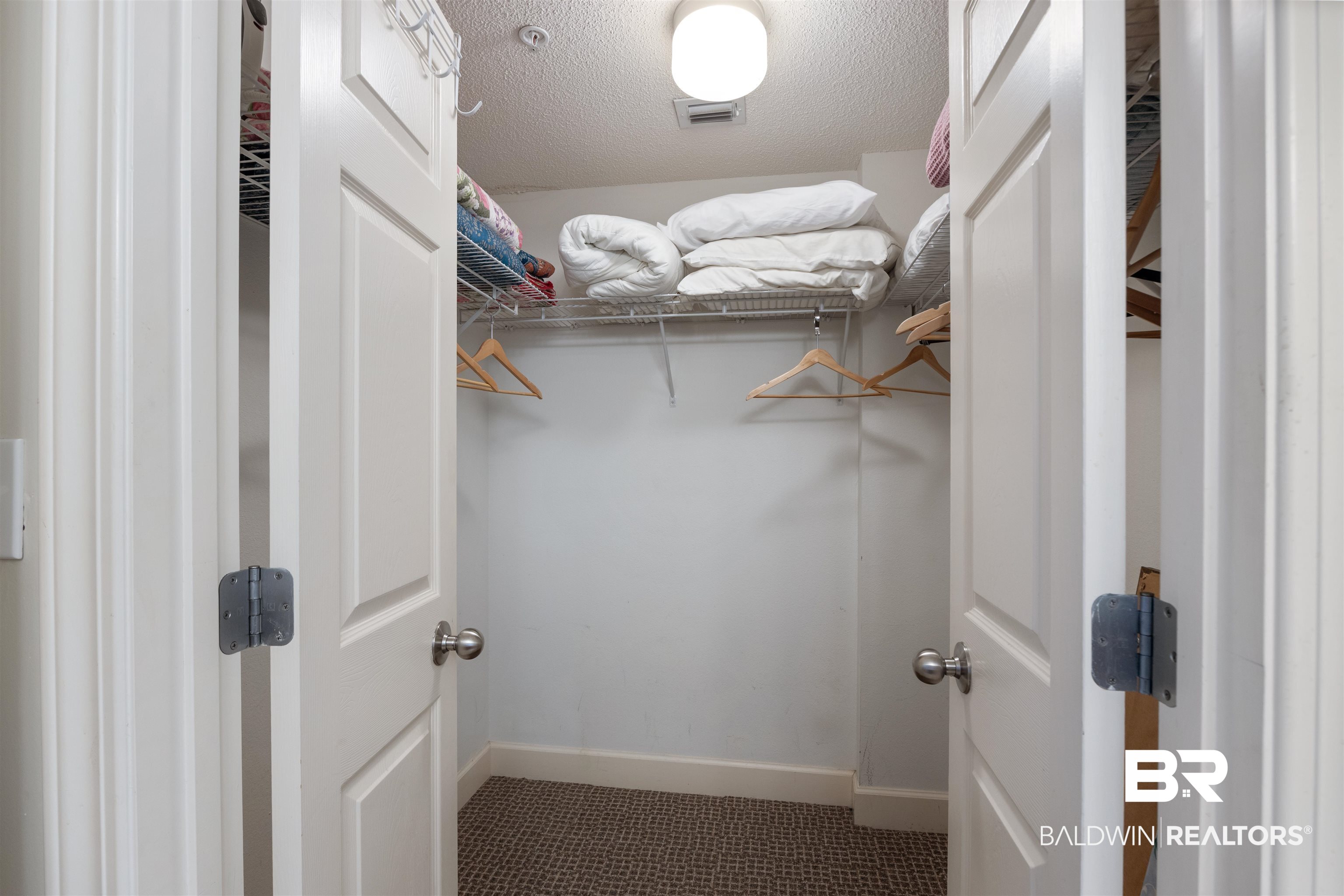 27580 Canal Road, Unit 1431 Orange Beach, AL 36561 - Photo 25 of 73 Walk in closet featuring tile patterned floors