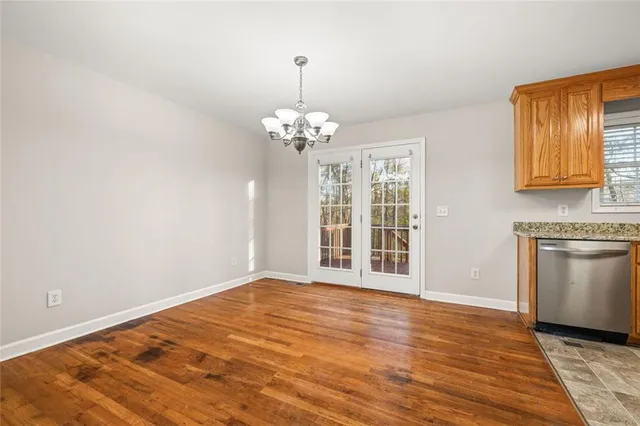 a kitchen with stainless steel appliances granite countertop a stove sink microwave and refrigerator