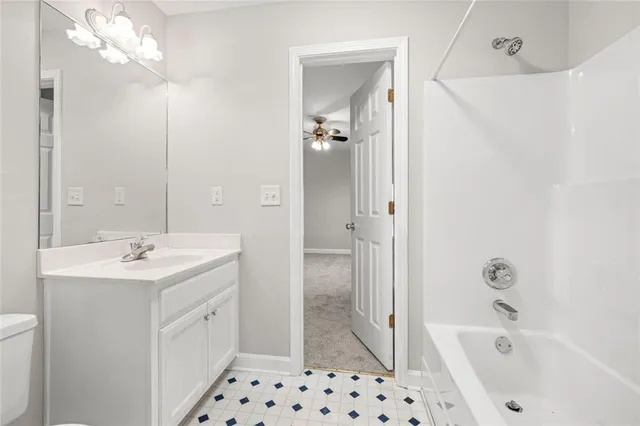 a bathroom with a shower and a bath tub