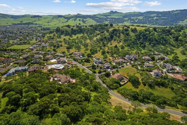 a view of a town with mountains in the background