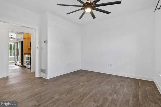 a view of a kitchen from the hallway