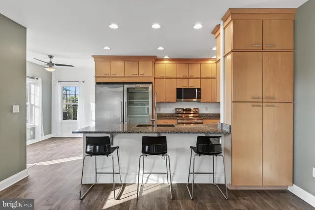 a kitchen with a sink and a fireplace