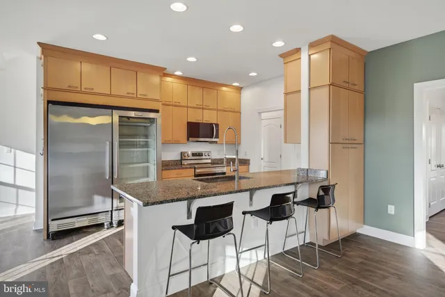 a kitchen with a stove and a microwave