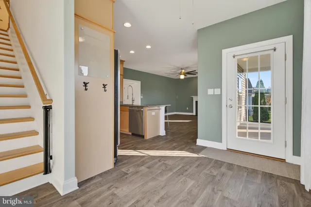 a view of empty room with a fireplace and fan