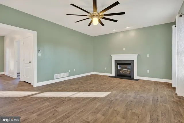 a view of a livingroom with a kitchen