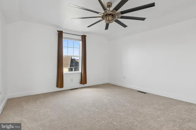 a view of a big room with carpet
