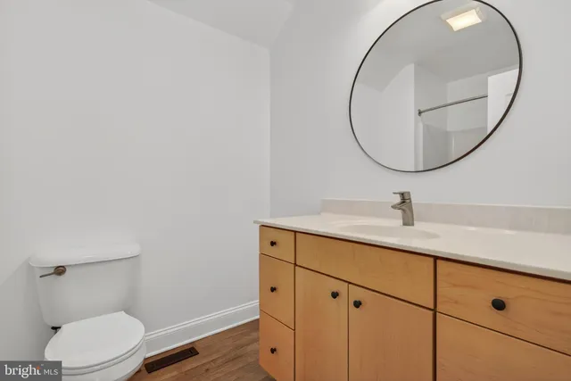 a view of a room with wooden floor