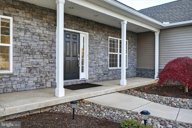 a view of a brick house with outdoor space