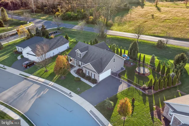 a view of a chairs and table in patio