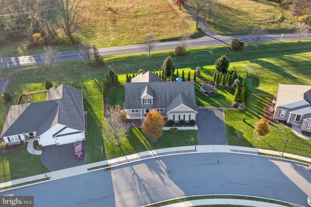 an aerial view of a house with outdoor space