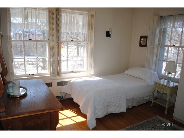 200 River Bluff Road Elgin, IL 60120 - Photo 11 of 19 a bedroom with a bed window and lamp