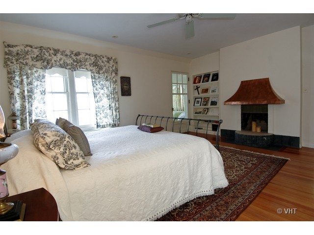 200 River Bluff Road Elgin, IL 60120 - Photo 14 of 19 a spacious bedroom with a bed a dresser next to a window