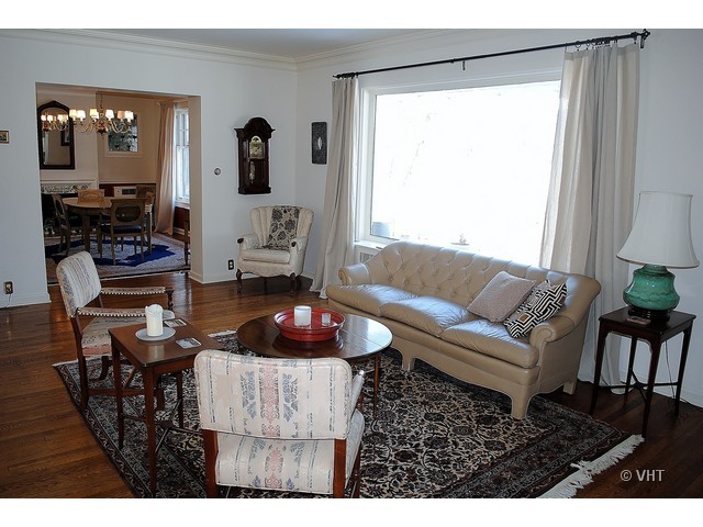 200 River Bluff Road Elgin, IL 60120 - Photo 5 of 19 a living room with furniture and a large mirror next to a window
