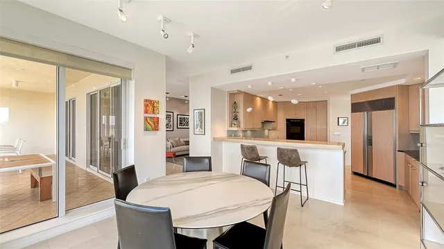 a bathroom with a tub shower and a sink