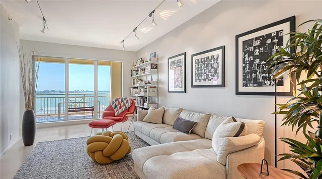 a living room with furniture and a rug