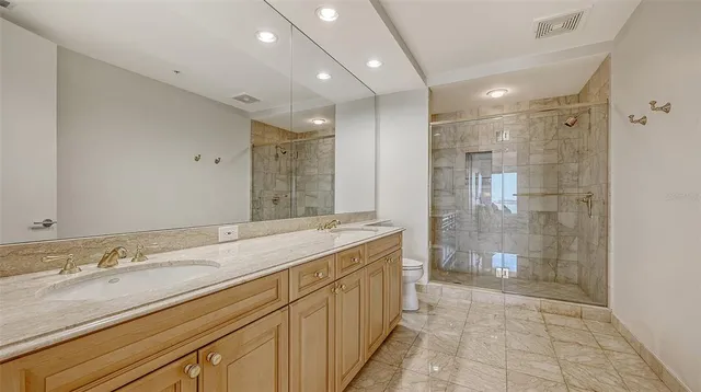 a view of a patio with table and chairs potted plants and palm tree