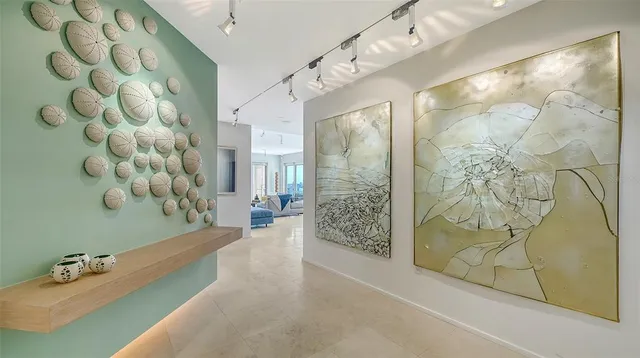 a living room with furniture wooden floor and a large window