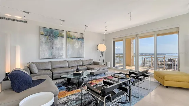 a living room with furniture and a large window