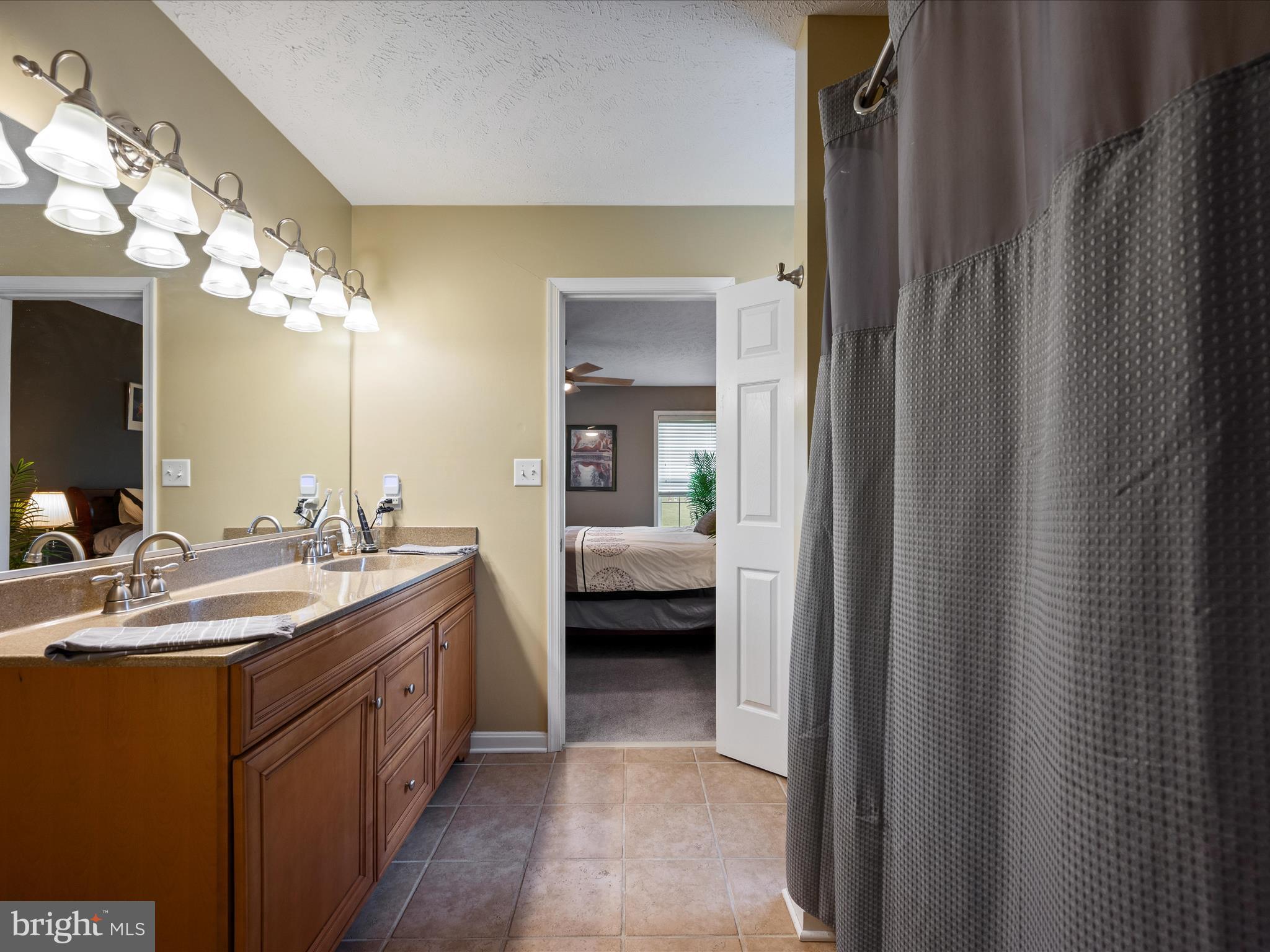 993 Rockland Road Front Royal, VA 22630 - Photo 16 of 37 a en suite bathroom with a double vanity sink and a mirror